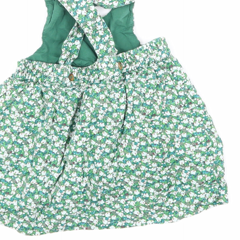 Brand and care label for Mini Club girls’ green floral a-line, size 0-3, months