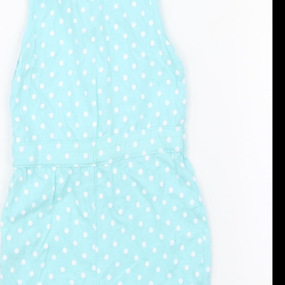 Brand and care label for Young Dimension girls’ blue polka dot babygrow one-piece, size 12-18, months