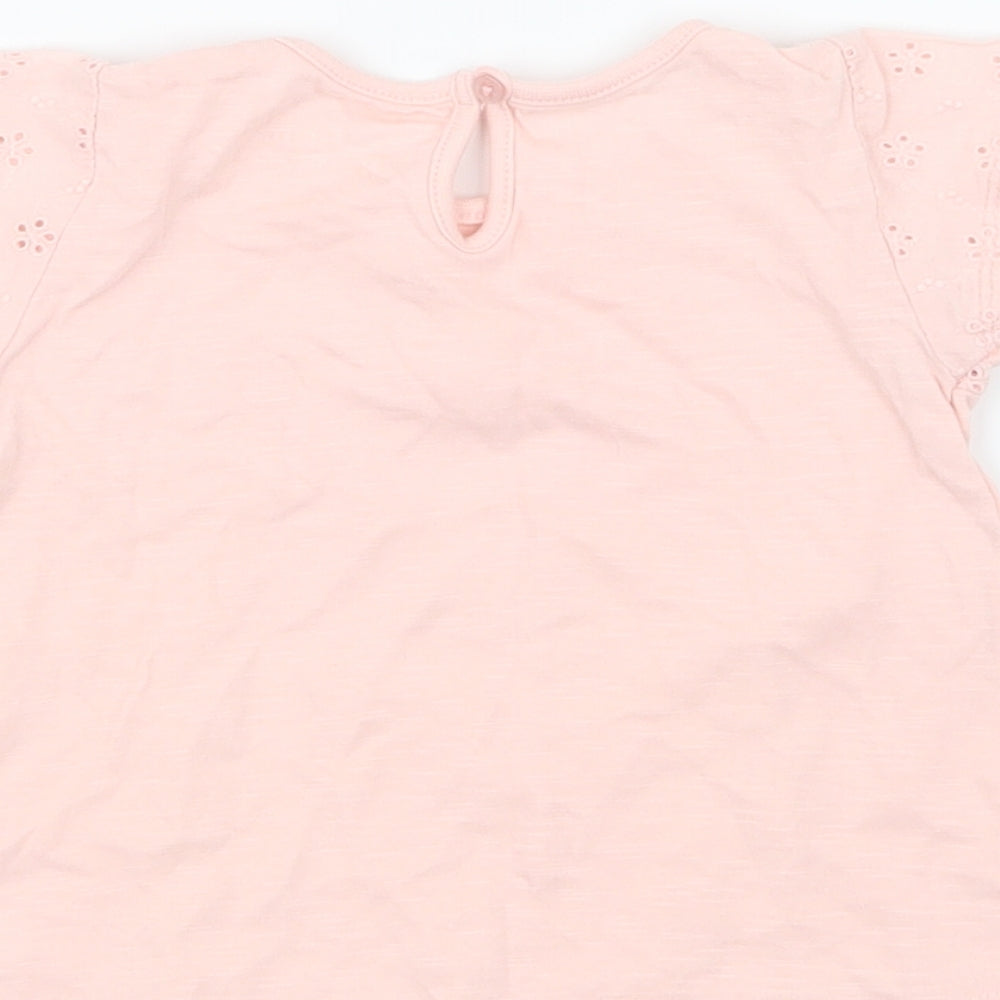 Brand and care label for Young Dimension girls’ pink basic t-shirt, size 9-12, months