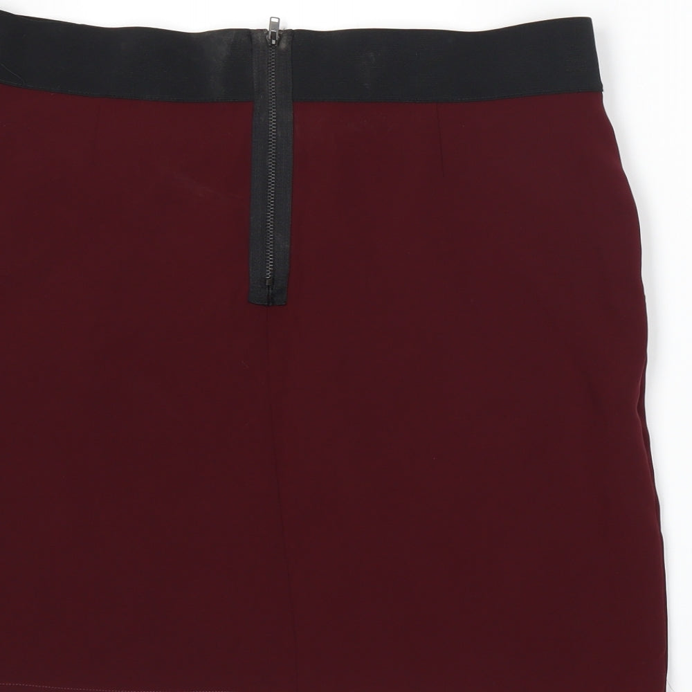 Brand and care label for IKKS women’s red a-line skirt, size UK 14
