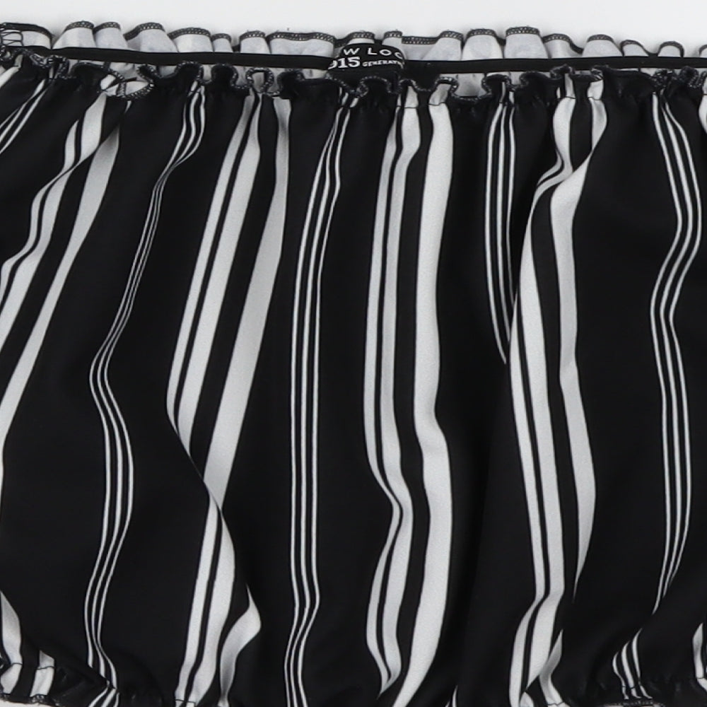 Brand and care label for New Look girls’ black striped basic blouse, size 12, years