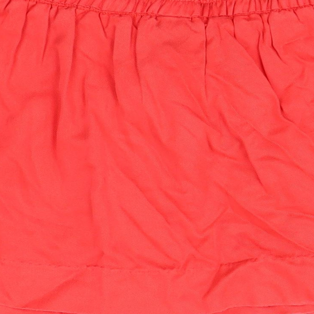 Brand and care label for MAX girls’ red maxi skirt, size 5-6, years