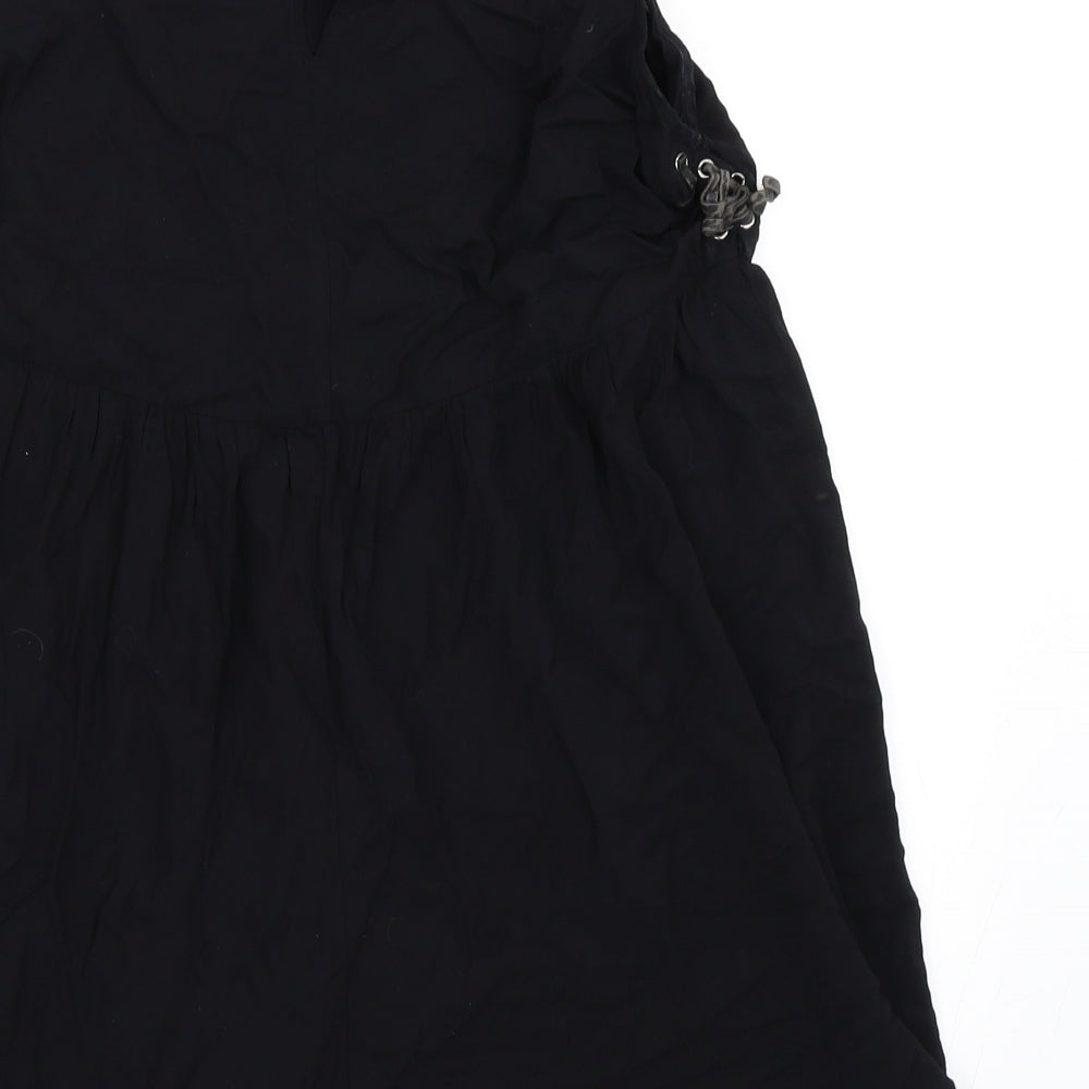 Brand and care label for Forever 21 women’s black skater dress, size M