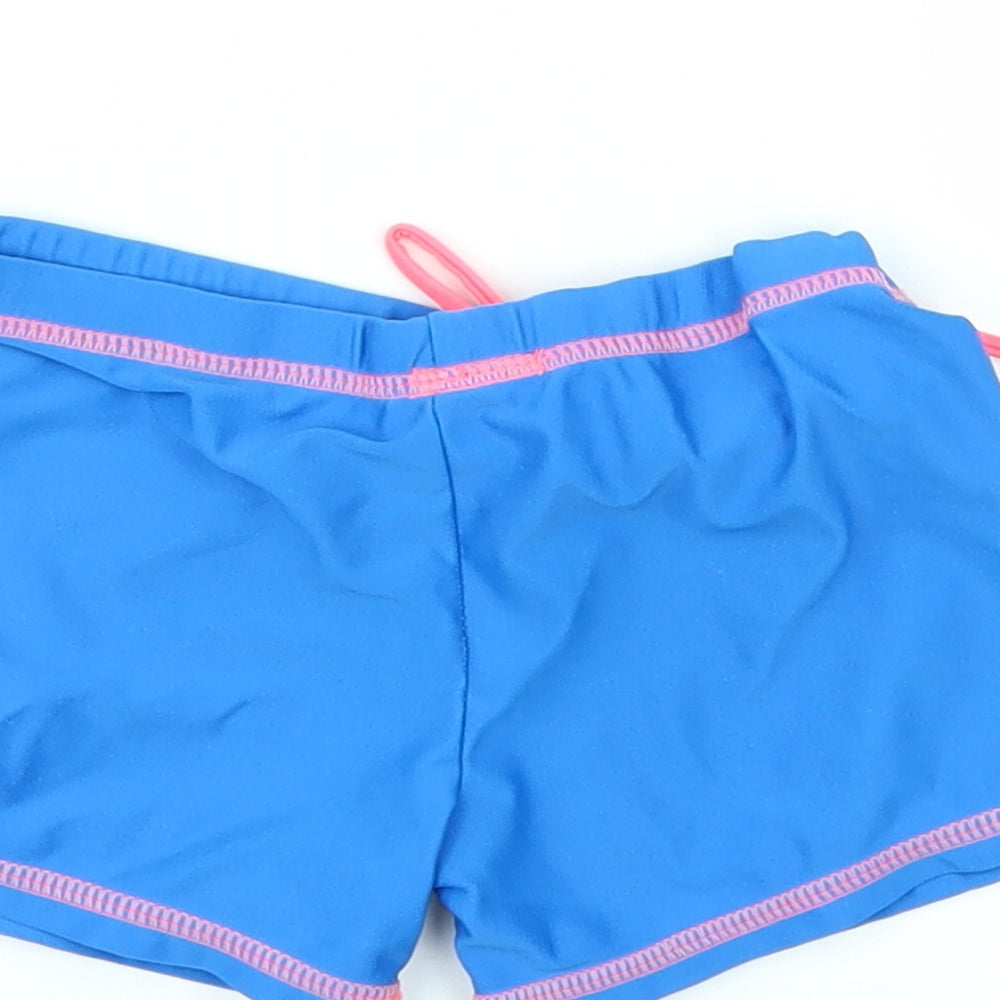 Brand and care label for TOTSOL boys’ blue sweat shorts, size 6, years