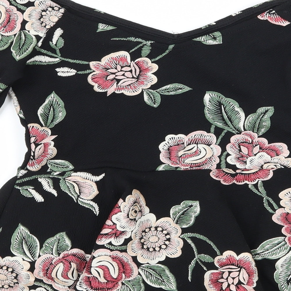 Brand and care label for New Look women’s black floral jersey basic blouse, size UK 8