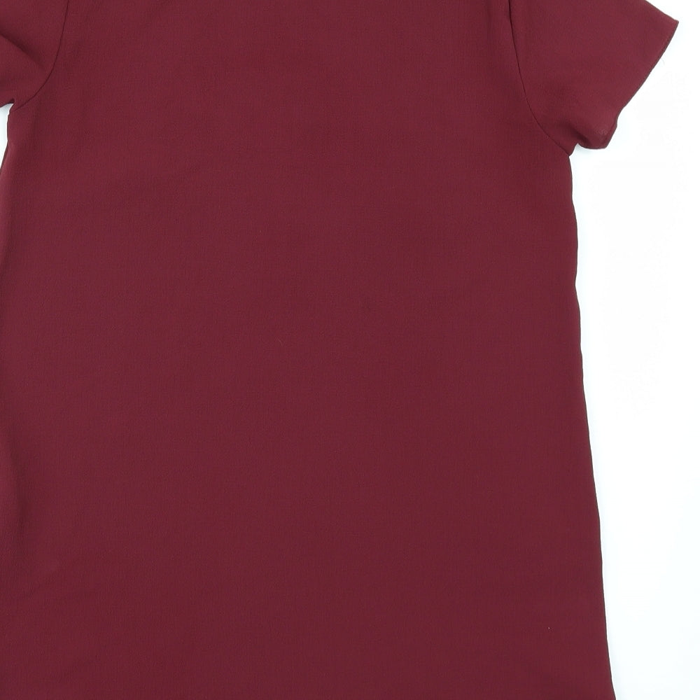 Brand and care label for New Look women’s red tunic blouse, size UK 6
