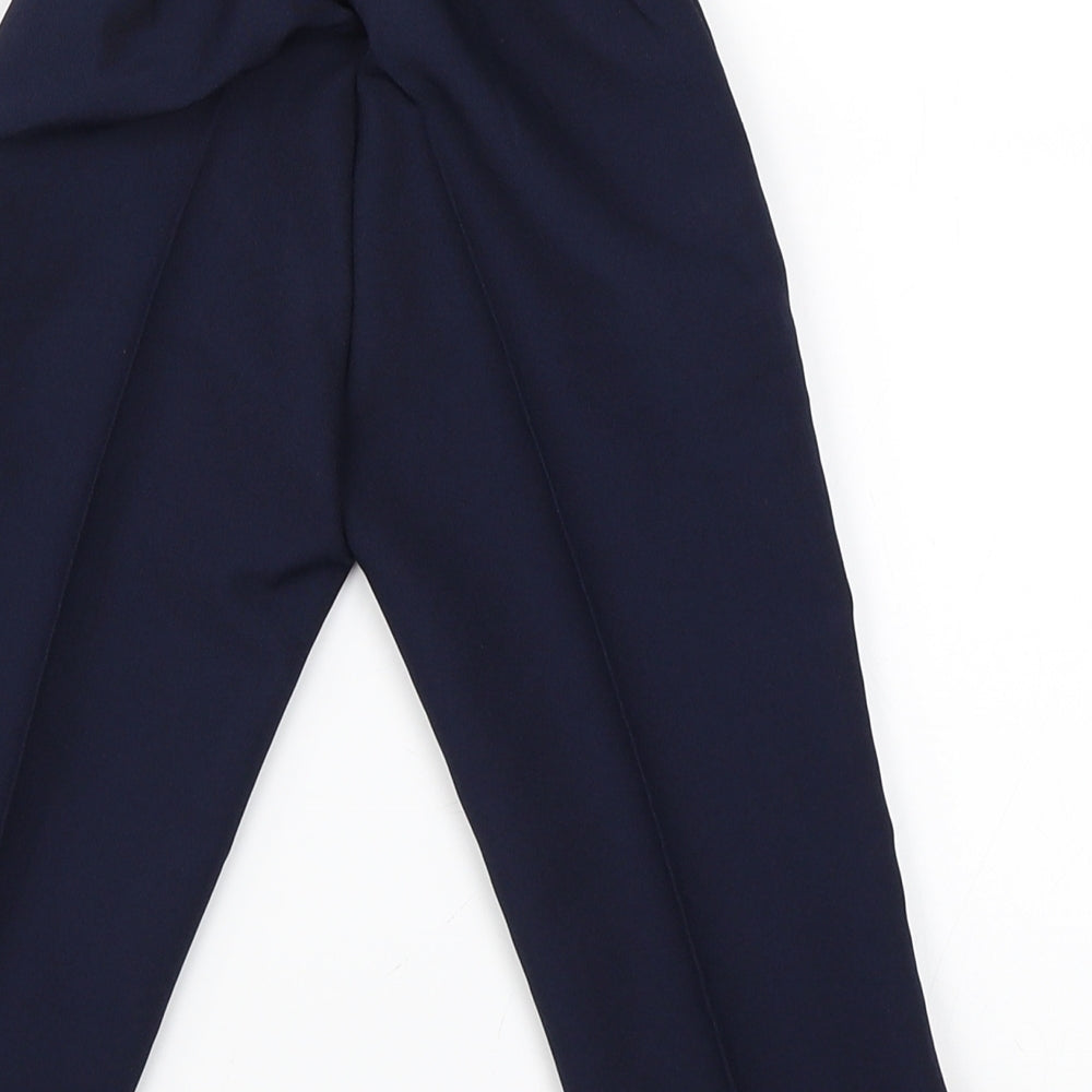 Brand and care label for Antonio Villini boys’ blue trousers, size 12, months