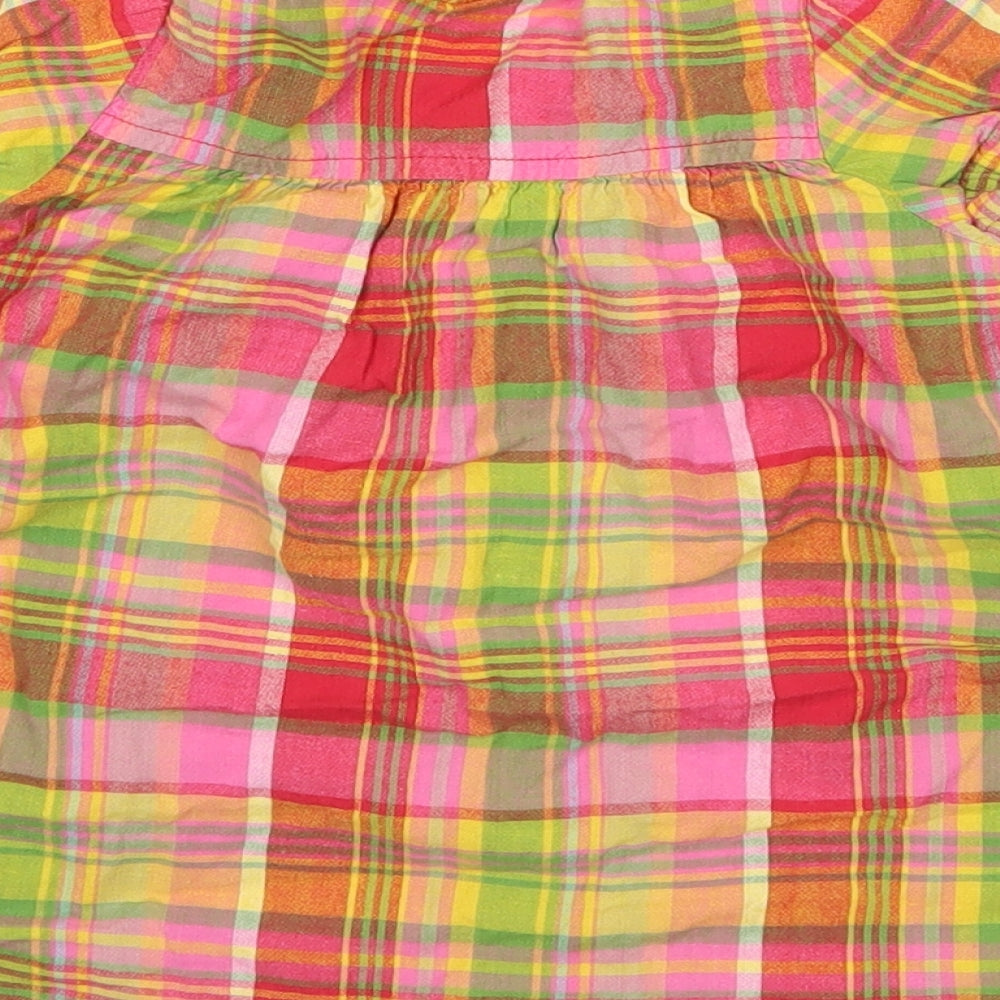 Brand and care label for Next girls’ pink check shirt dress, size 6-9, months