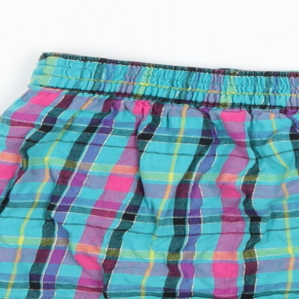 Brand and care label for Garanimals girls’ blue check a-line skirt, size 3, years
