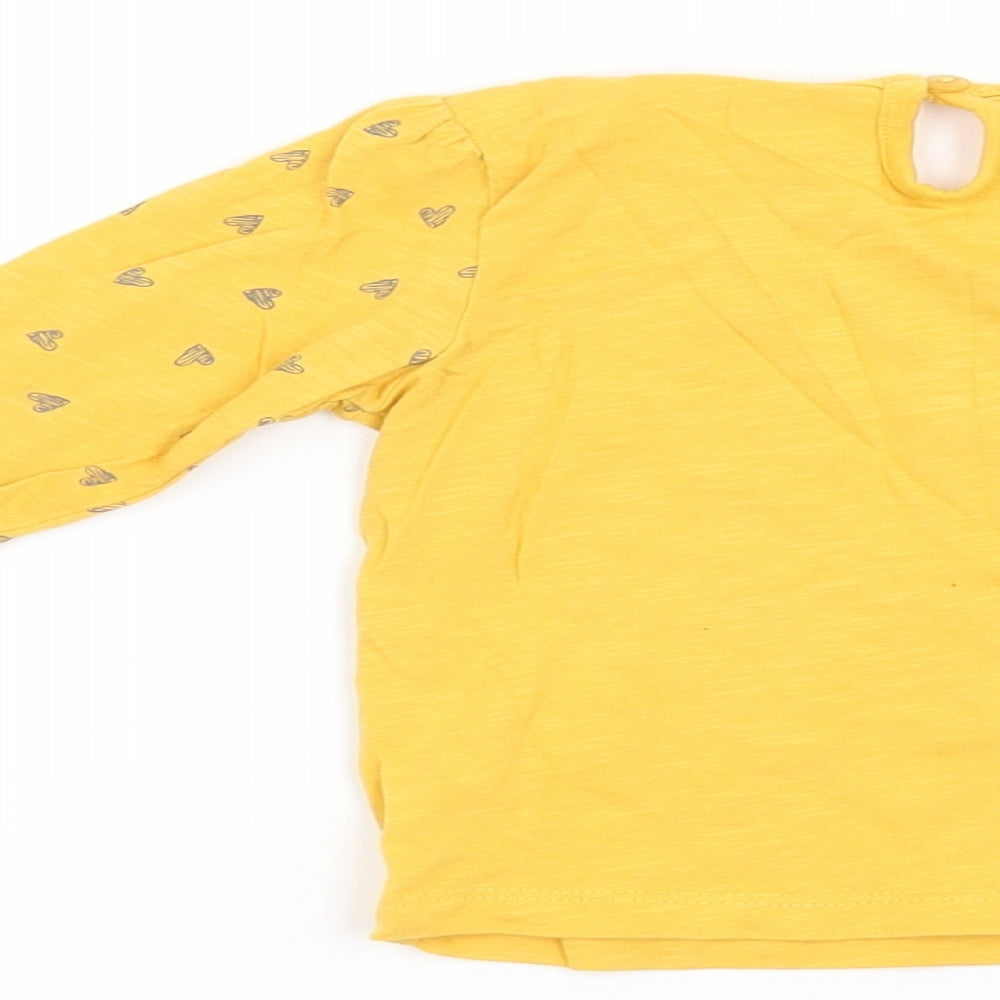 Brand and care label for Matalan girls’ yellow basic t-shirt, size 9-12, months - lovely cute