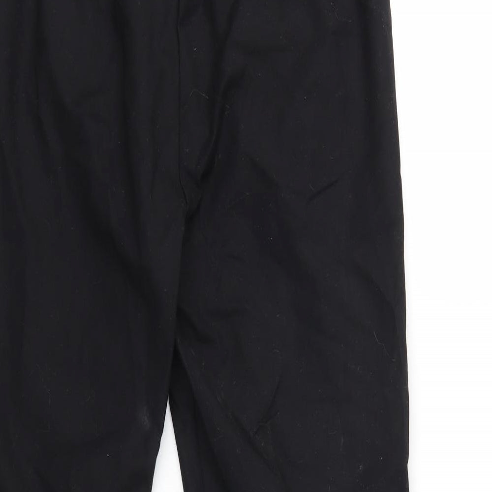 Brand and care label for Marks & Spencer women’s black trousers, size UK 12, 23-inch leg