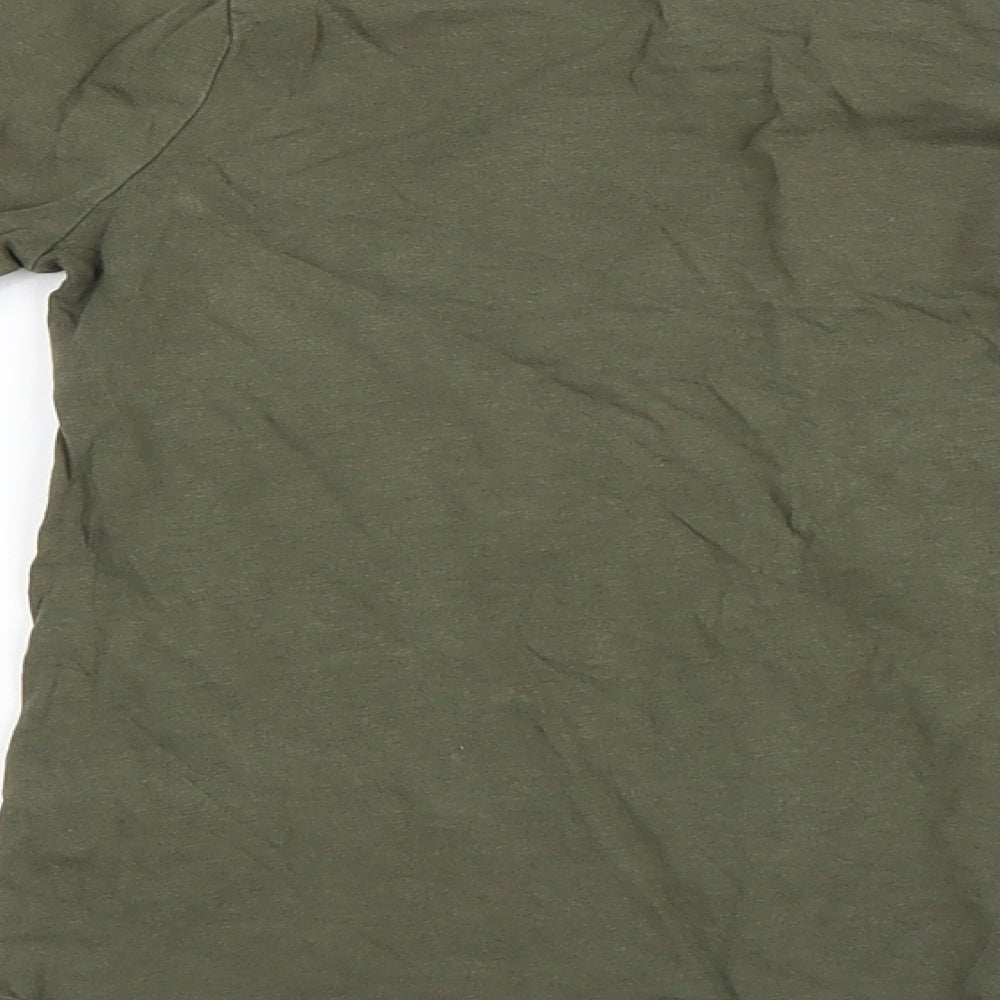 Brand and care label for Primark girls’ green basic t-shirt, size 8, years
