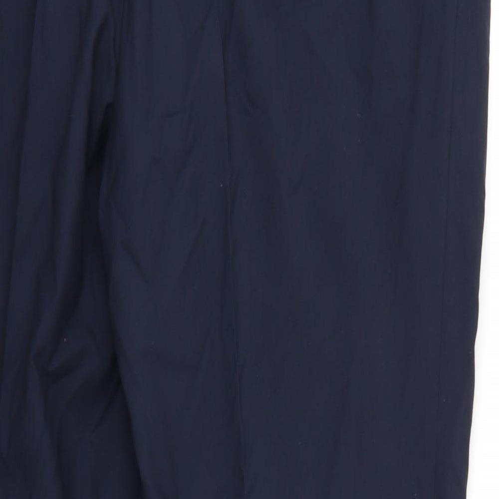 Brand and care label for Essentials men’s blue rayon trousers, 29-inch leg