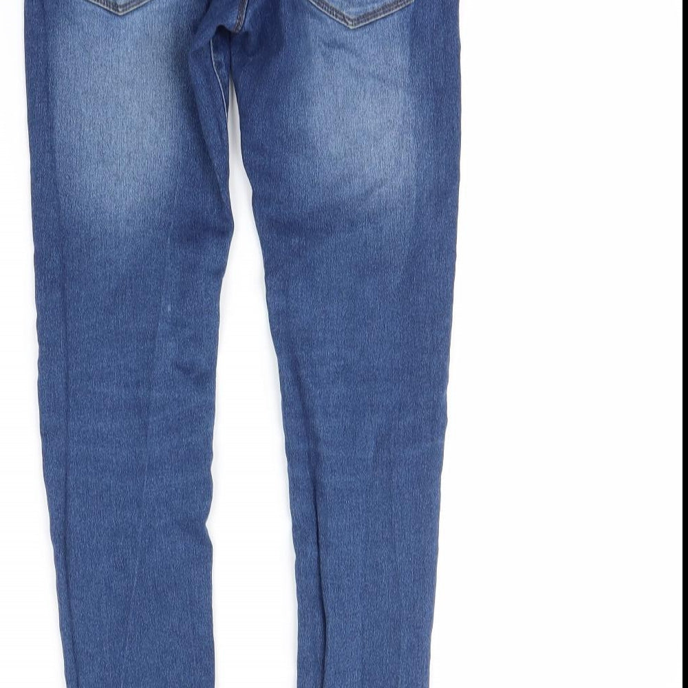 Brand and care label for Miss Evie girls’ blue skinny jeans, size 12, years