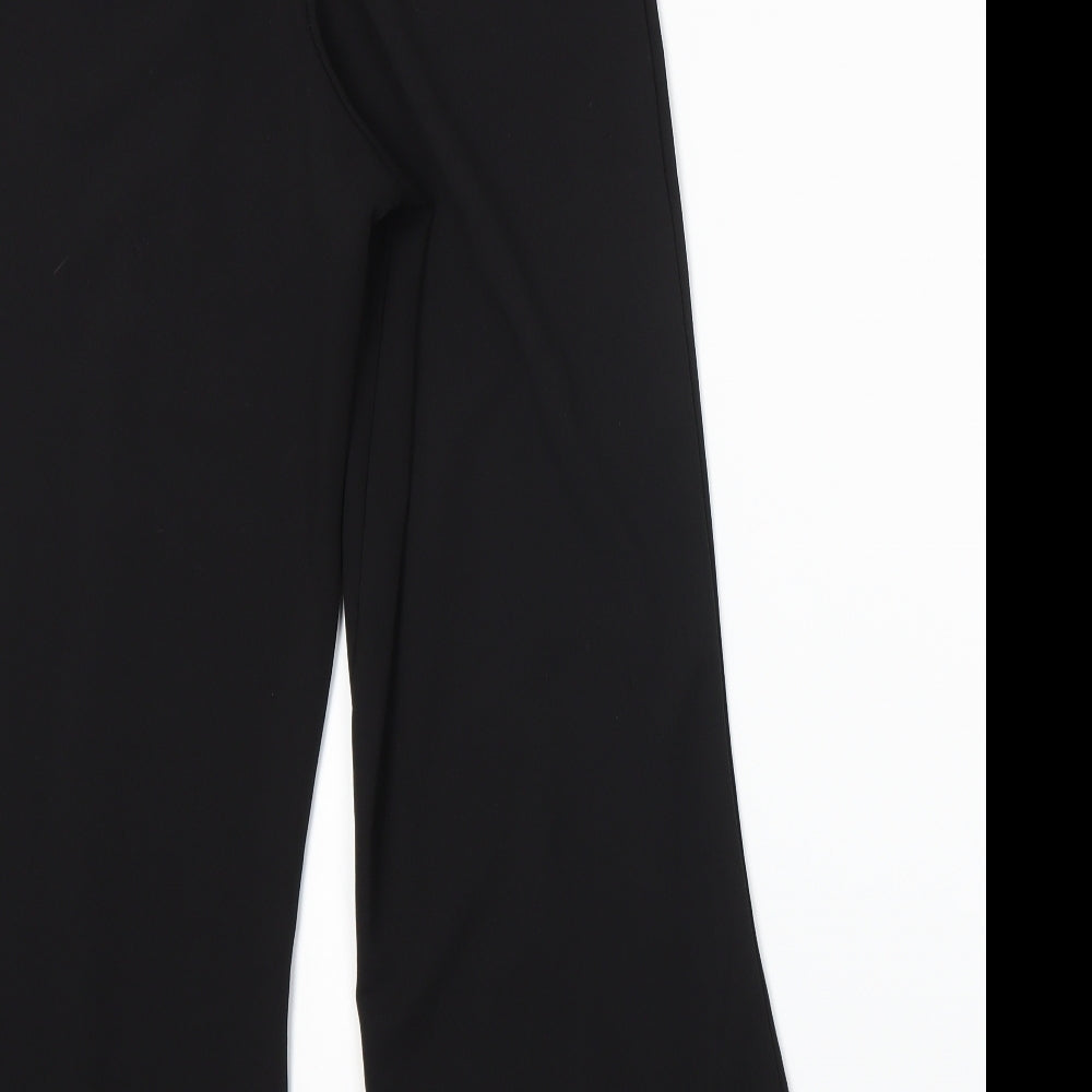 Brand and care label for Missguided women’s black trousers, size UK 10, 25-inch leg