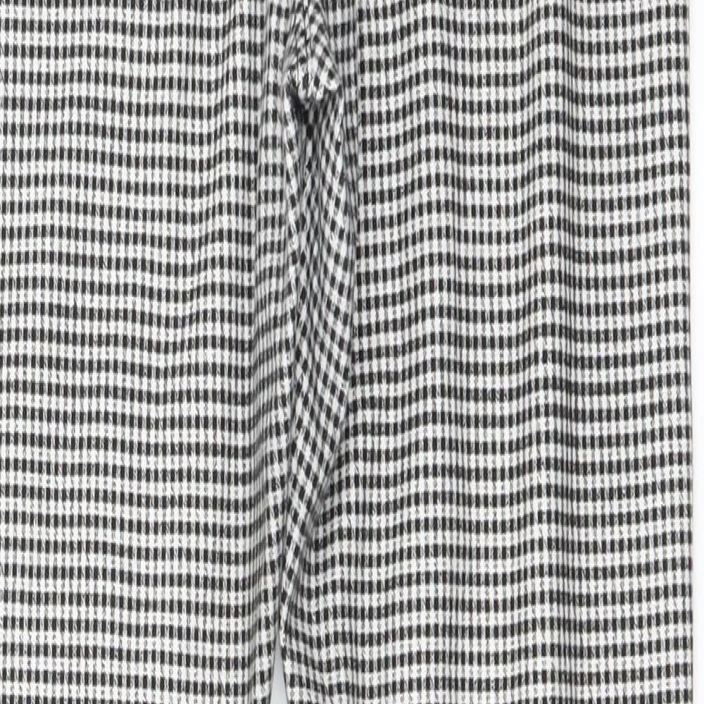 Brand and care label for Topshop women’s white check jegging trousers, size UK 10, 27-inch leg