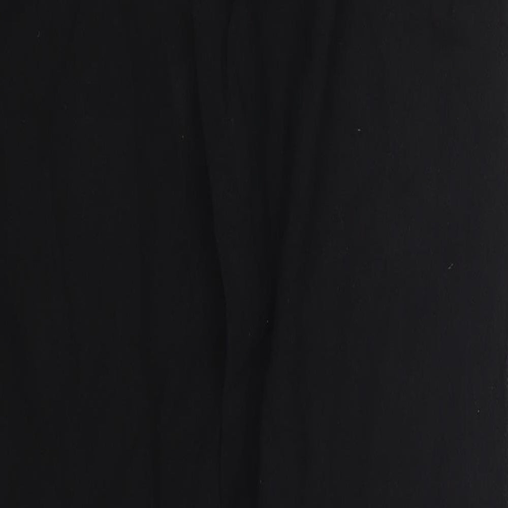 Brand and care label for La Cotonniere women’s black trousers, size M, 30-inch leg