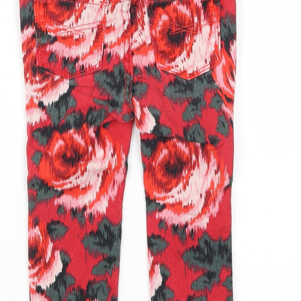 Brand and care label for GA girls’ red floral denim capri jeans, size 18-24, months