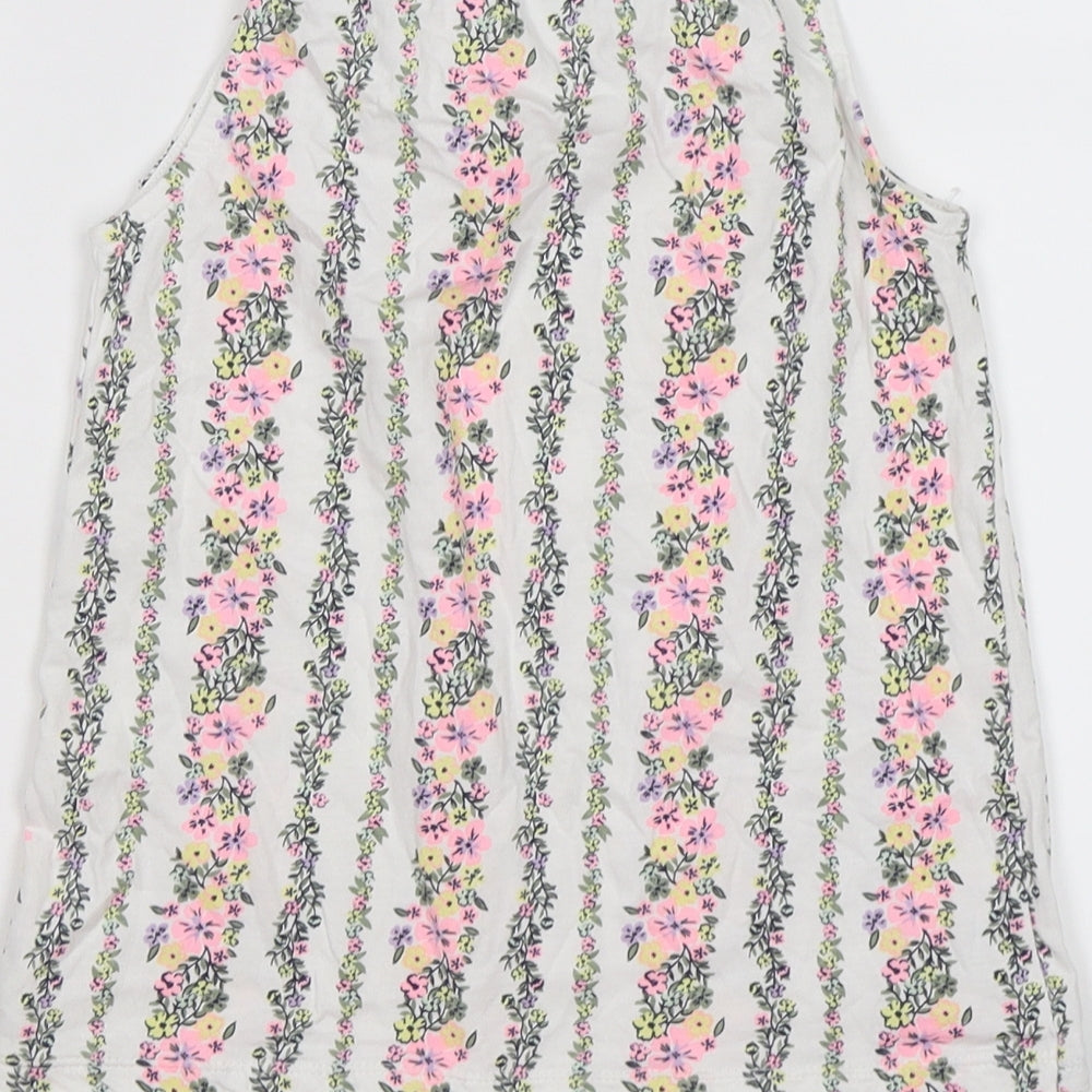 Brand and care label for Matalan girls’ white floral crepe tunic tank, size 10, years