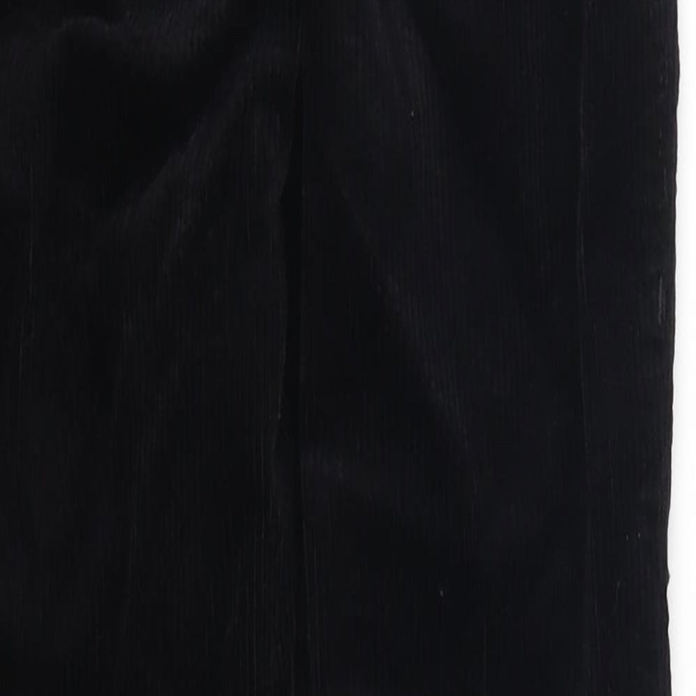 Brand and care label for Topshop women’s black corduroy trousers, size UK 25, in, 25-inch leg