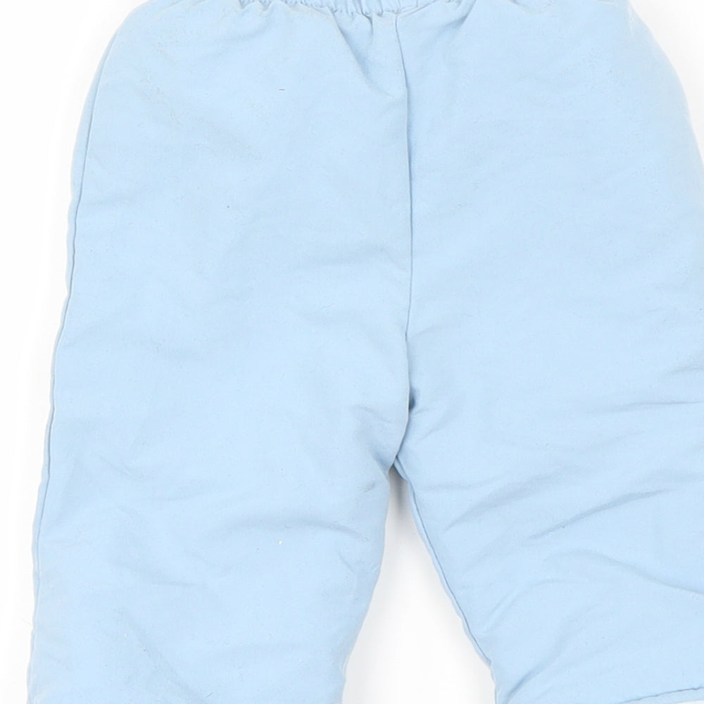 Brand and care label for Preworn boys’ blue rain trousers trousers, size 0-3, months