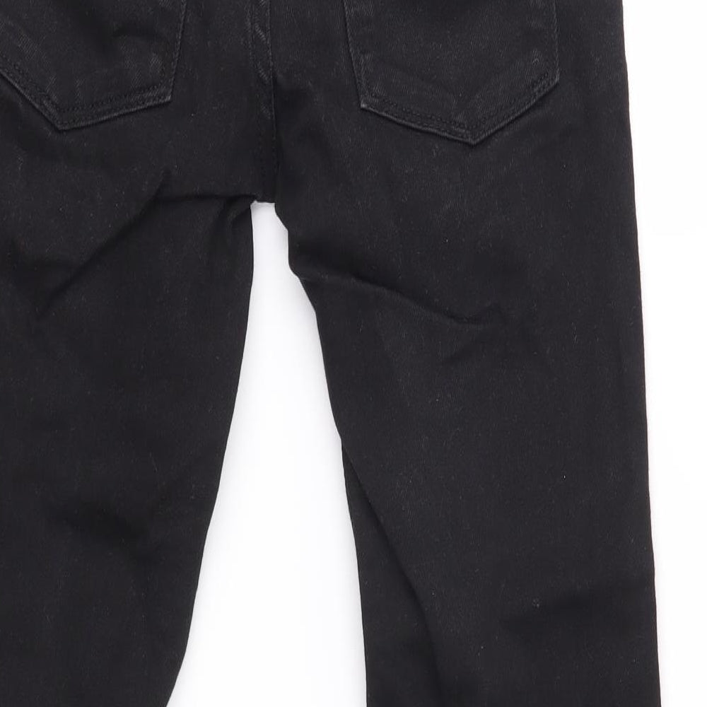 Brand and care label for Next boys’ black skinny jeans, size 9, years
