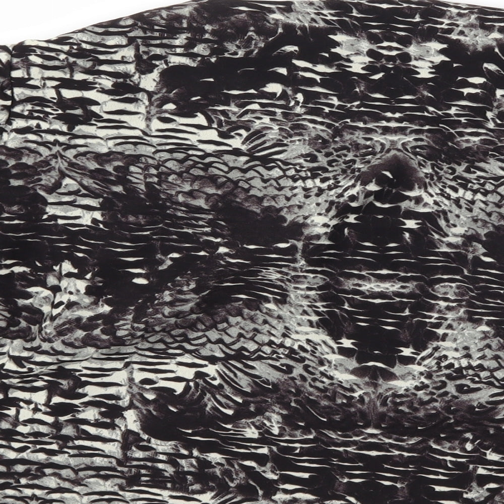 Brand and care label for Topshop women’s black animal print jacket, size UK 8