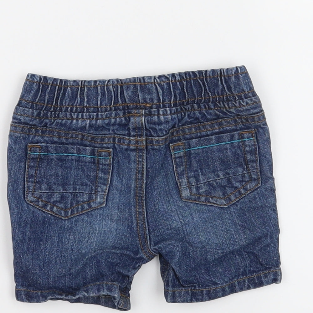 Brand and care label for Early Days boys’ blue cropped jeans, size 3-6, months