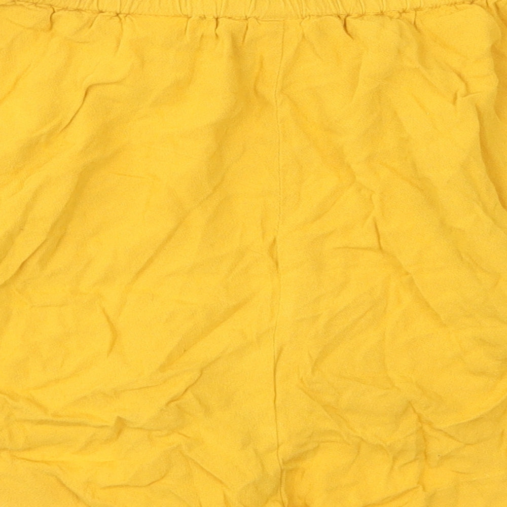 Brand and care label for H&M women’s yellow hot pants shorts, size UK 36