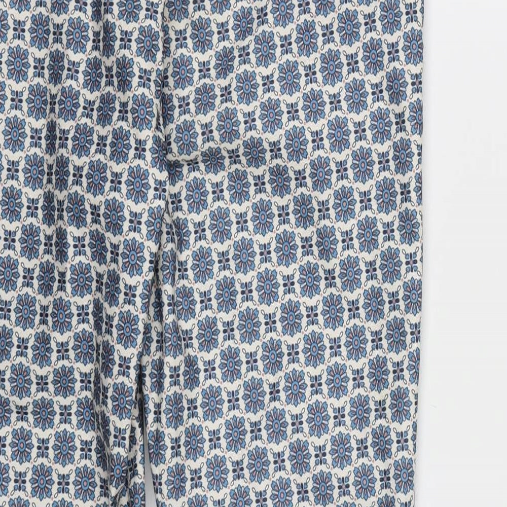 Brand and care label for New Look women’s blue geometric rayon chino trousers, size UK 12, 26-inch leg