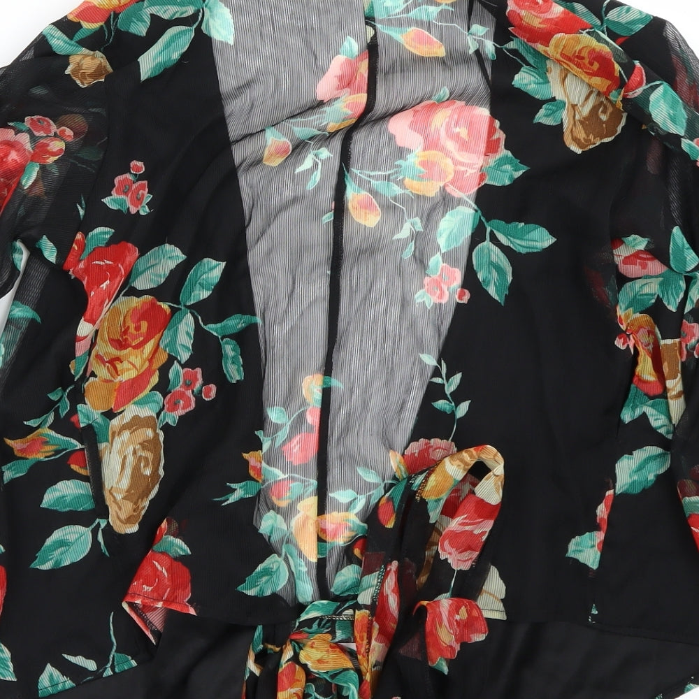 Brand and care label for Miss Selfridge women’s black floral basic blouse, size UK 6