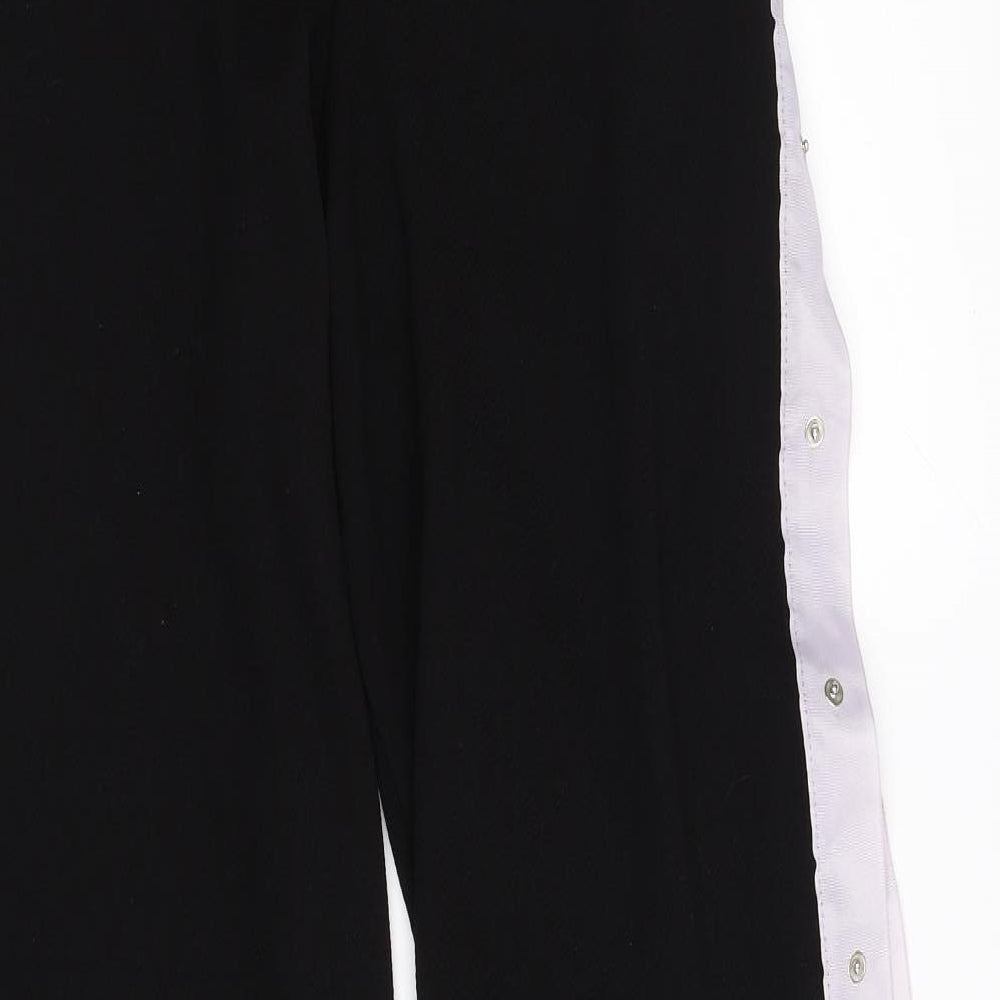 Brand and care label for pretty little thing women’s black trousers, size UK 8, 22.5-inch leg