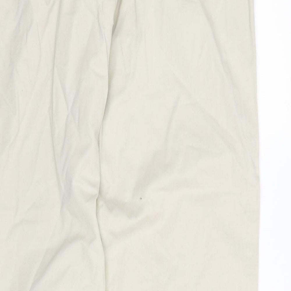 Brand and care label for pre worn men’s beige trousers, size L, 30-inch leg