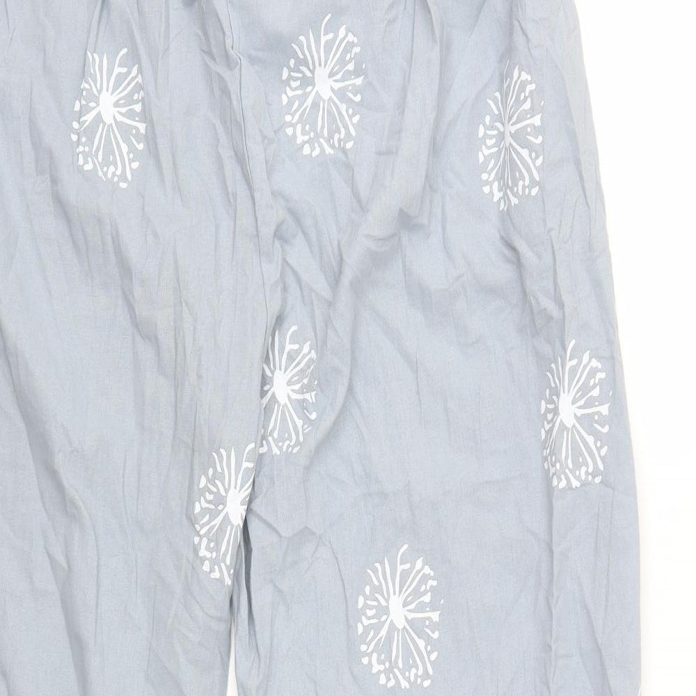 Brand and care label for Preworn women’s grey floral trousers, size UK 39, in, 23-inch leg