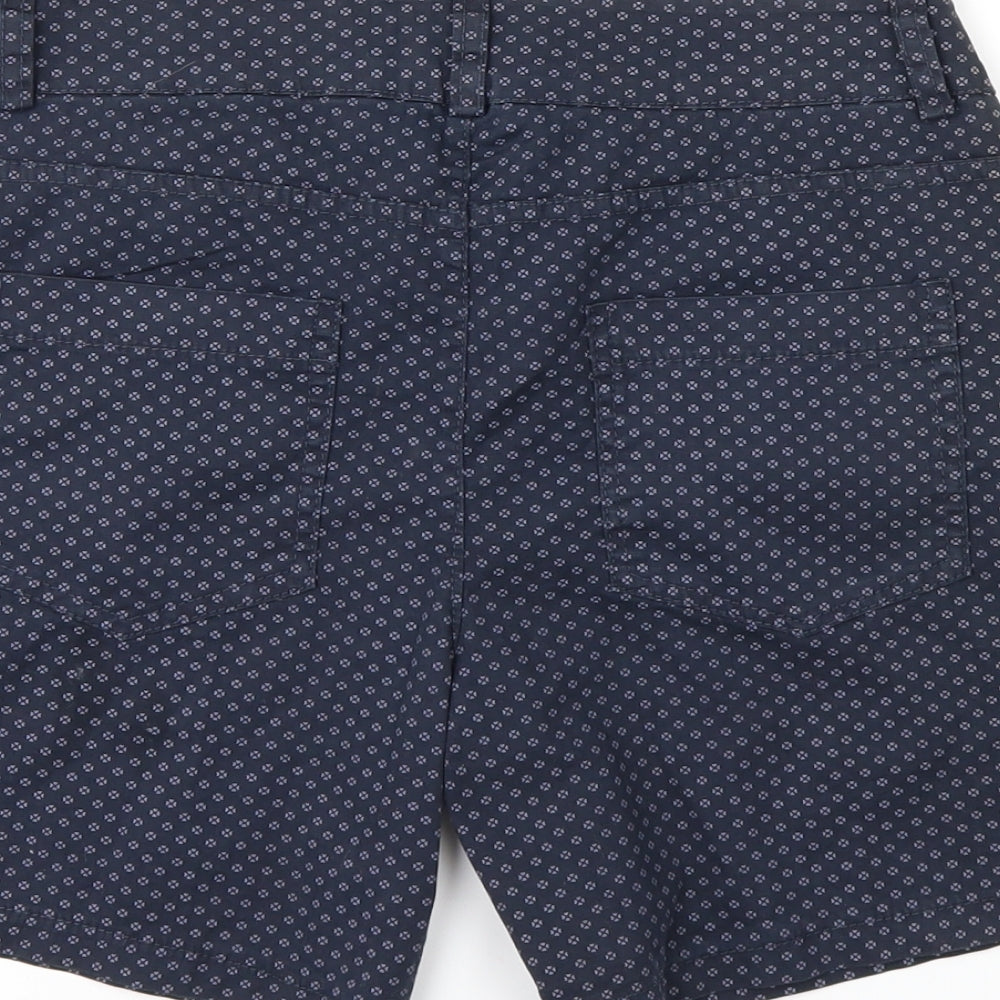 Brand and care label for COSSET women’s blue polka dot sweat shorts, size S