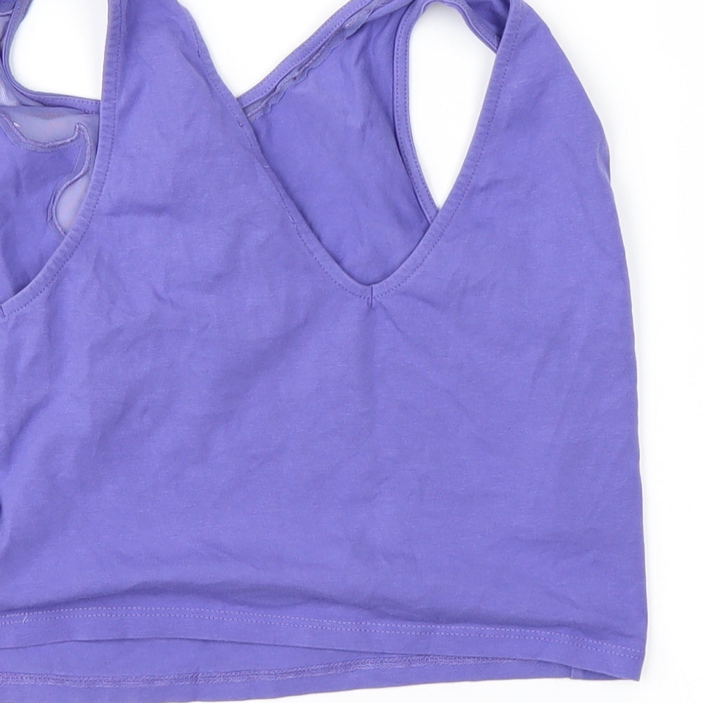 Brand and care label for Oxxo girls’ purple basic t-shirt, size L