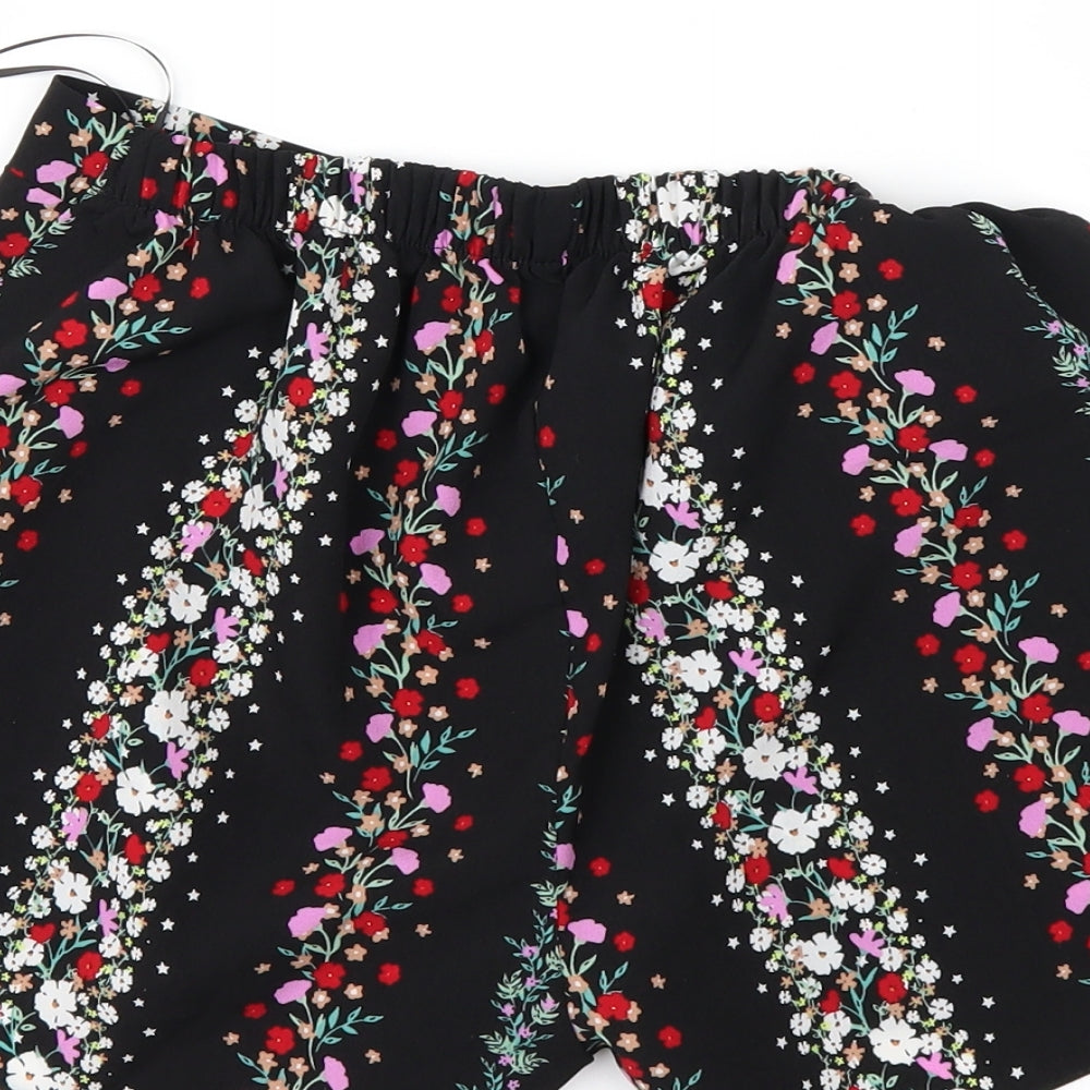 Brand and care label for Preworn women’s black floral paperbag shorts, size UK 8