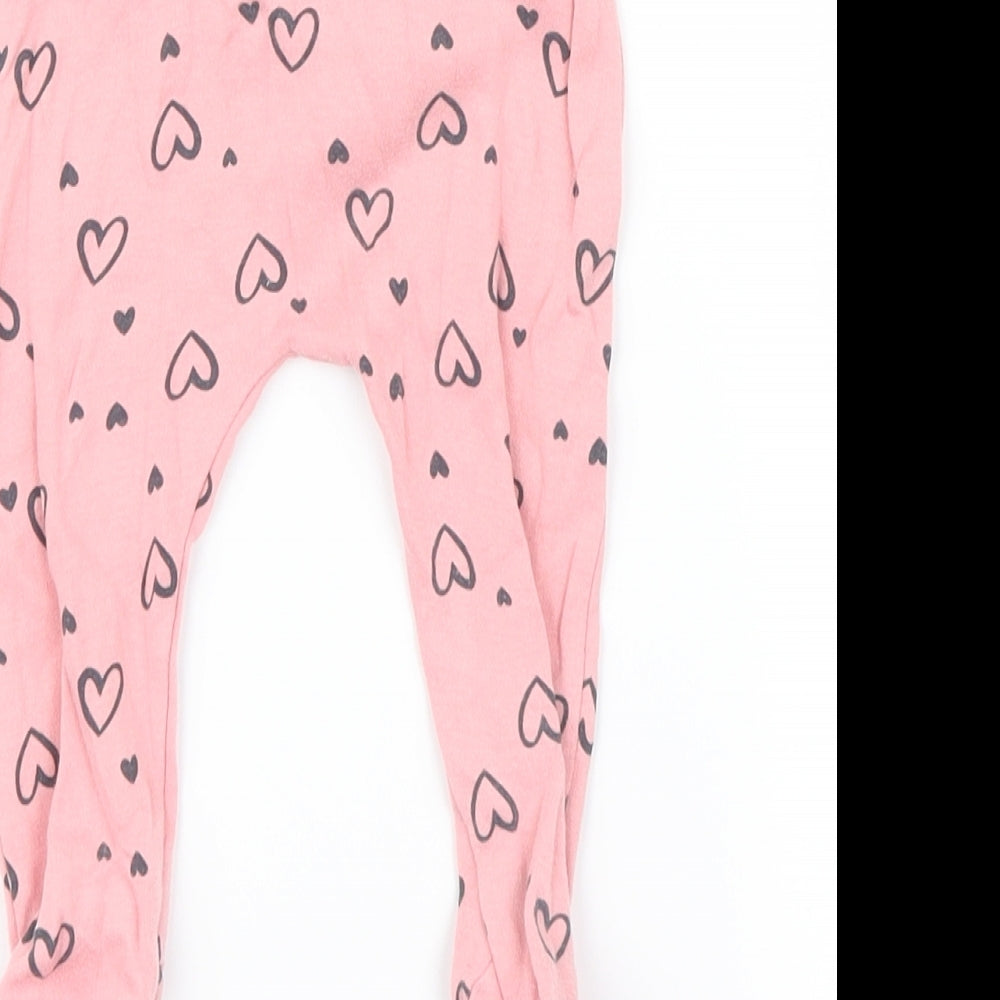 Brand and care label for George girls’ pink geometric capri leggings, size 3-6, months - hearts