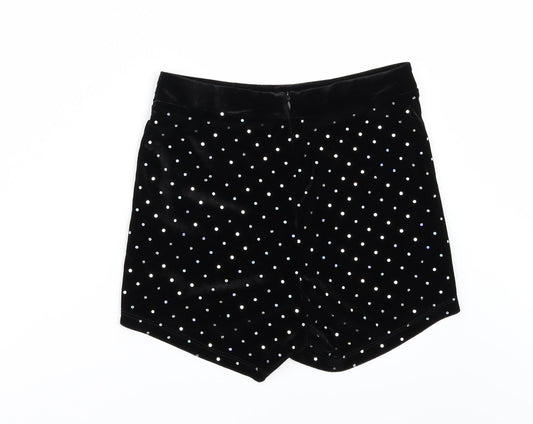 Back view of Bershka women’s black polka dot velour hot pants shorts, size UK 10