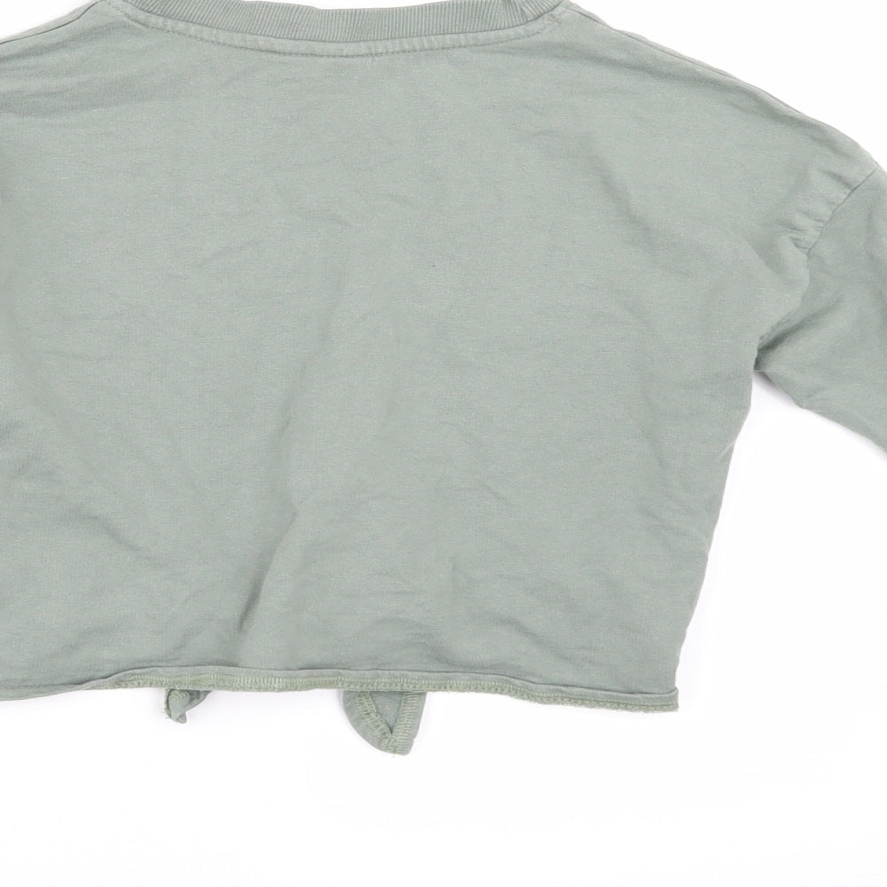 Brand and care label for H&M girls’ green pullover sweatshirt, size 9-10, years