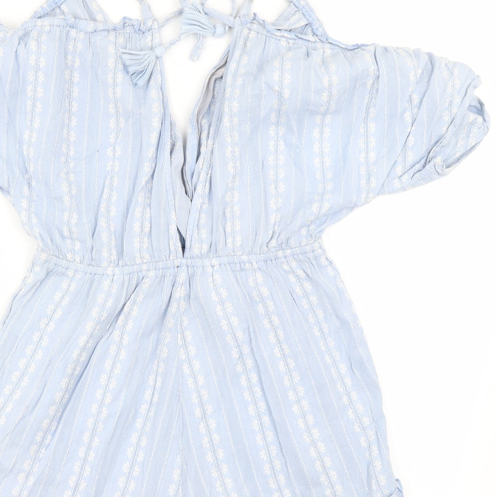 Brand and care label for women’s blue jumpsuit one-piece, size S