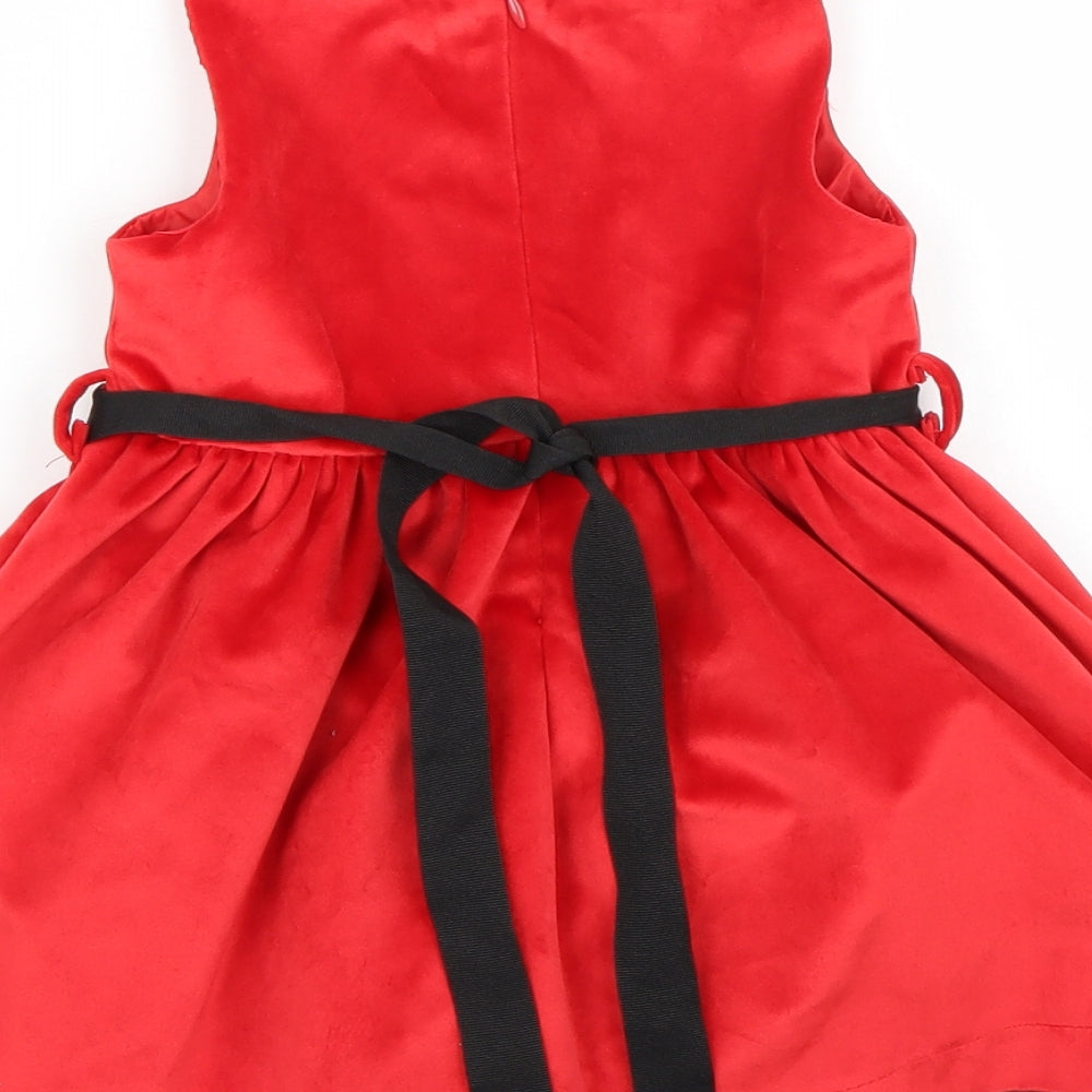 Brand and care label for Piaza Italia girls’ red a-line, size 12-18, months
