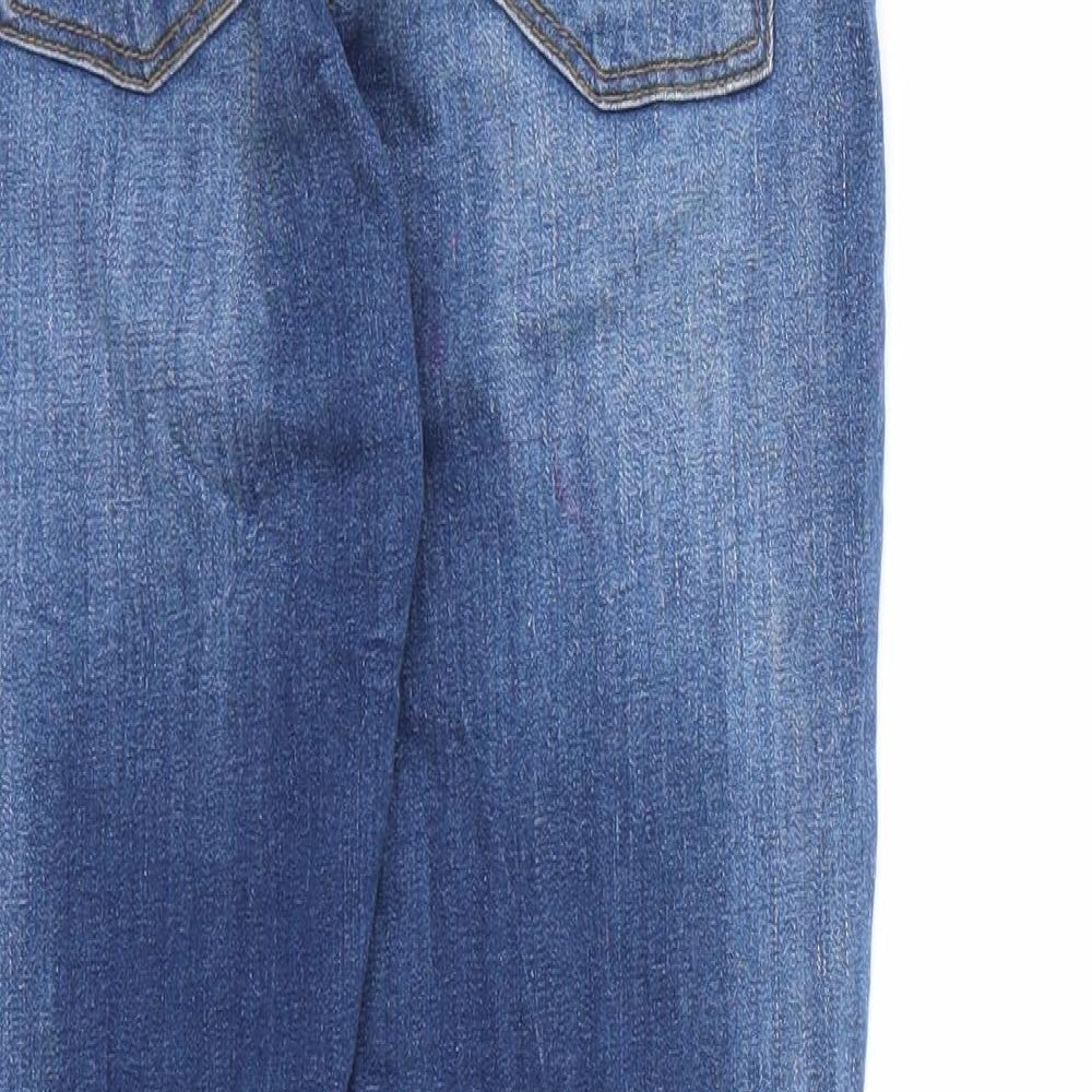 Brand and care label for Candy Couture girls’ blue denim skinny jeans, size 11, years