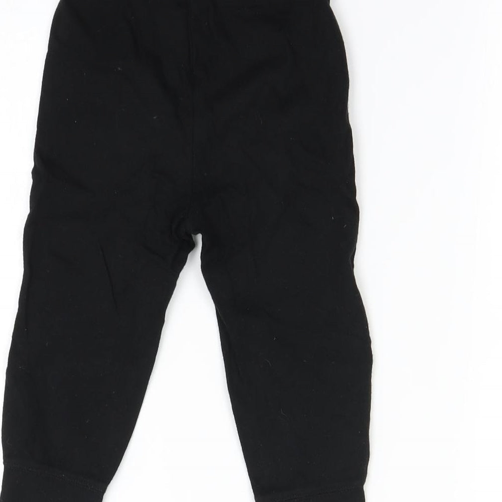 Brand and care label for Gap boys’ black jogger trousers, size 2, years