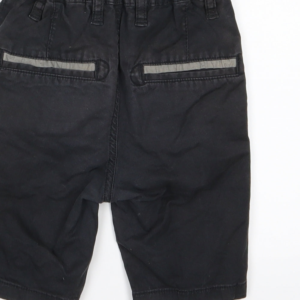 Brand and care label for Very boys’ black chino shorts, size 5, years