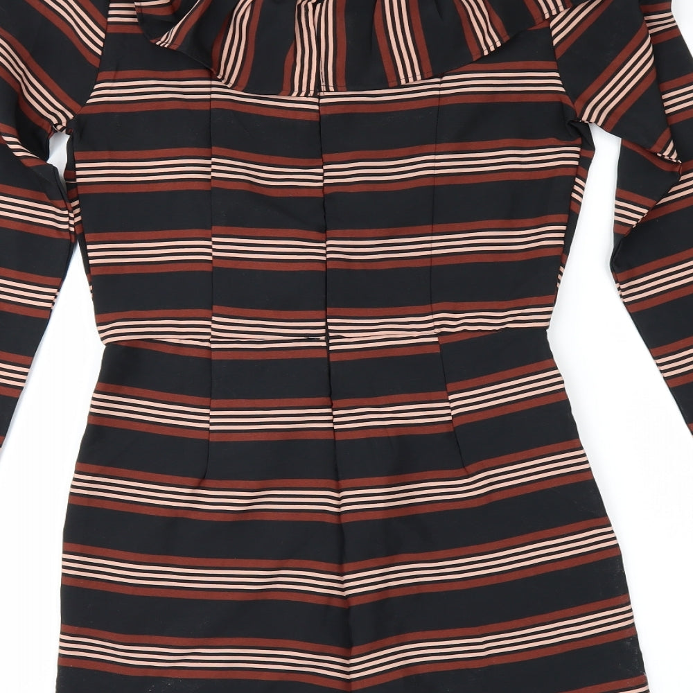 Brand and care label for ASOS women’s black striped playsuit one-piece, size UK 8
