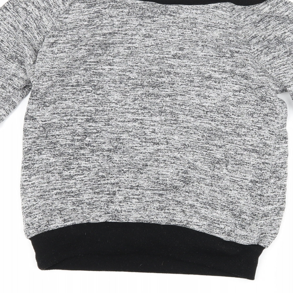 Brand and care label for Select women’s grey jumper, size S