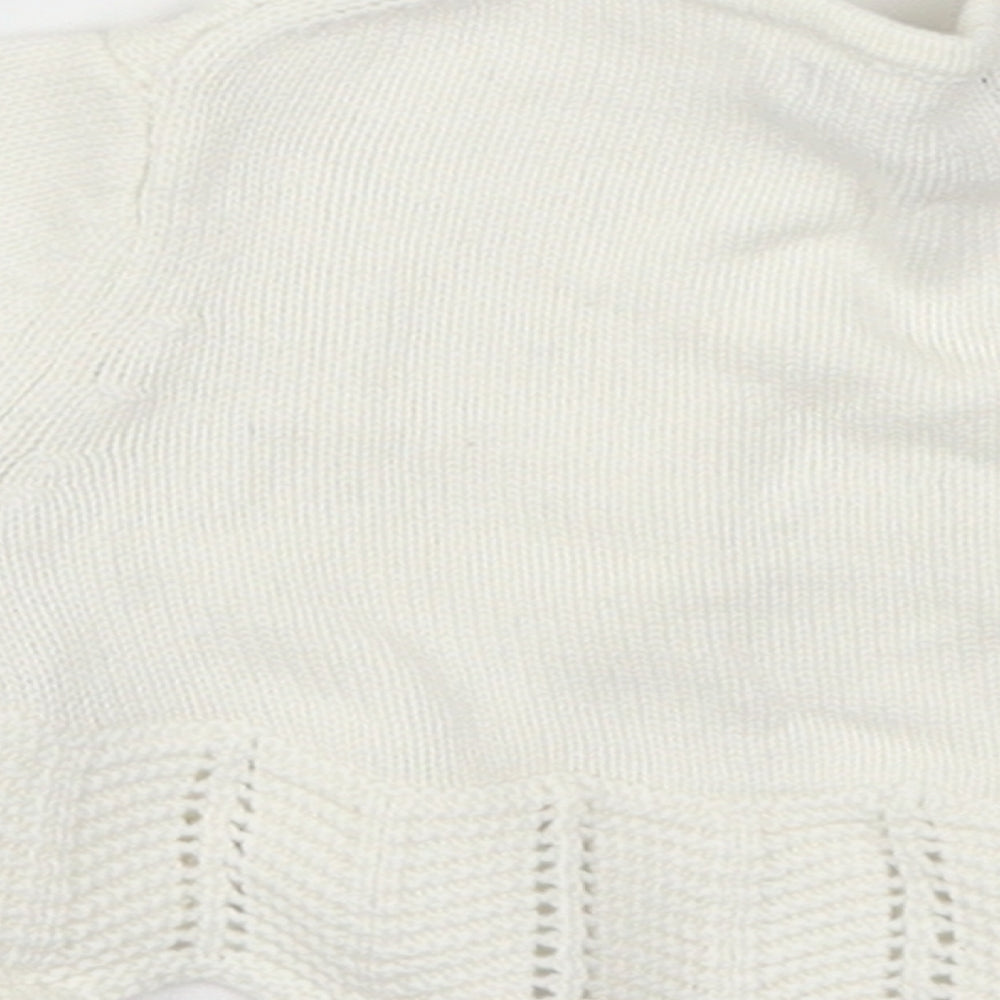 Brand and care label for Gap girls’ white cardigan jumper, size 6-9, months