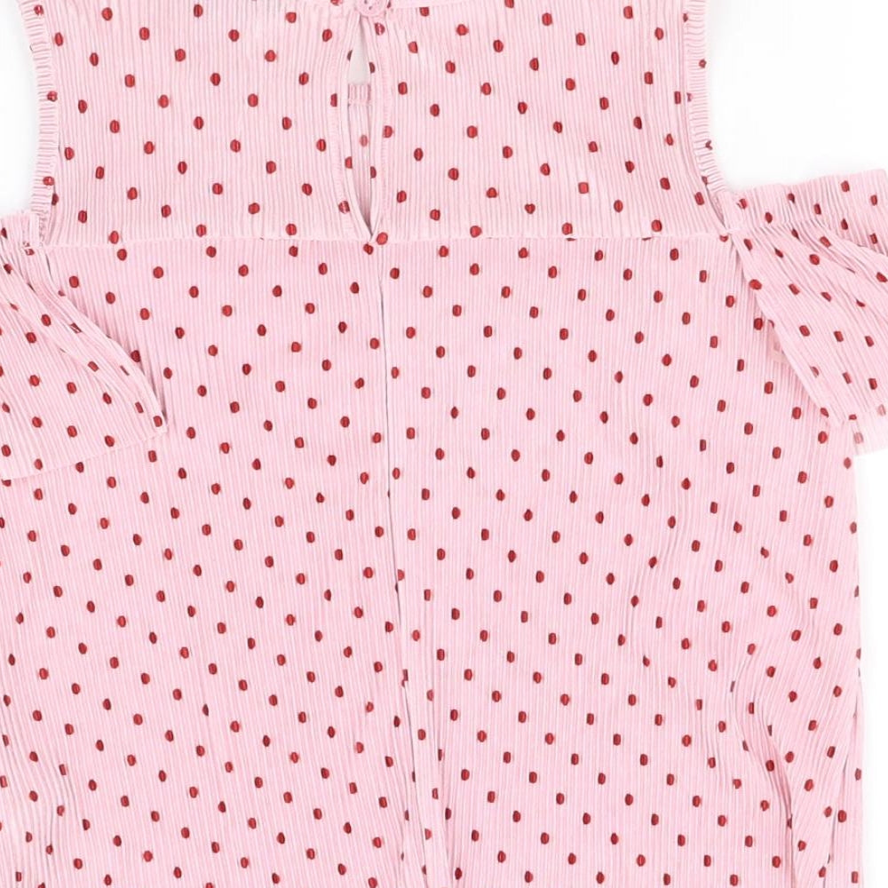 Brand and care label for Primark girls’ pink basic blouse, size 6-7, years