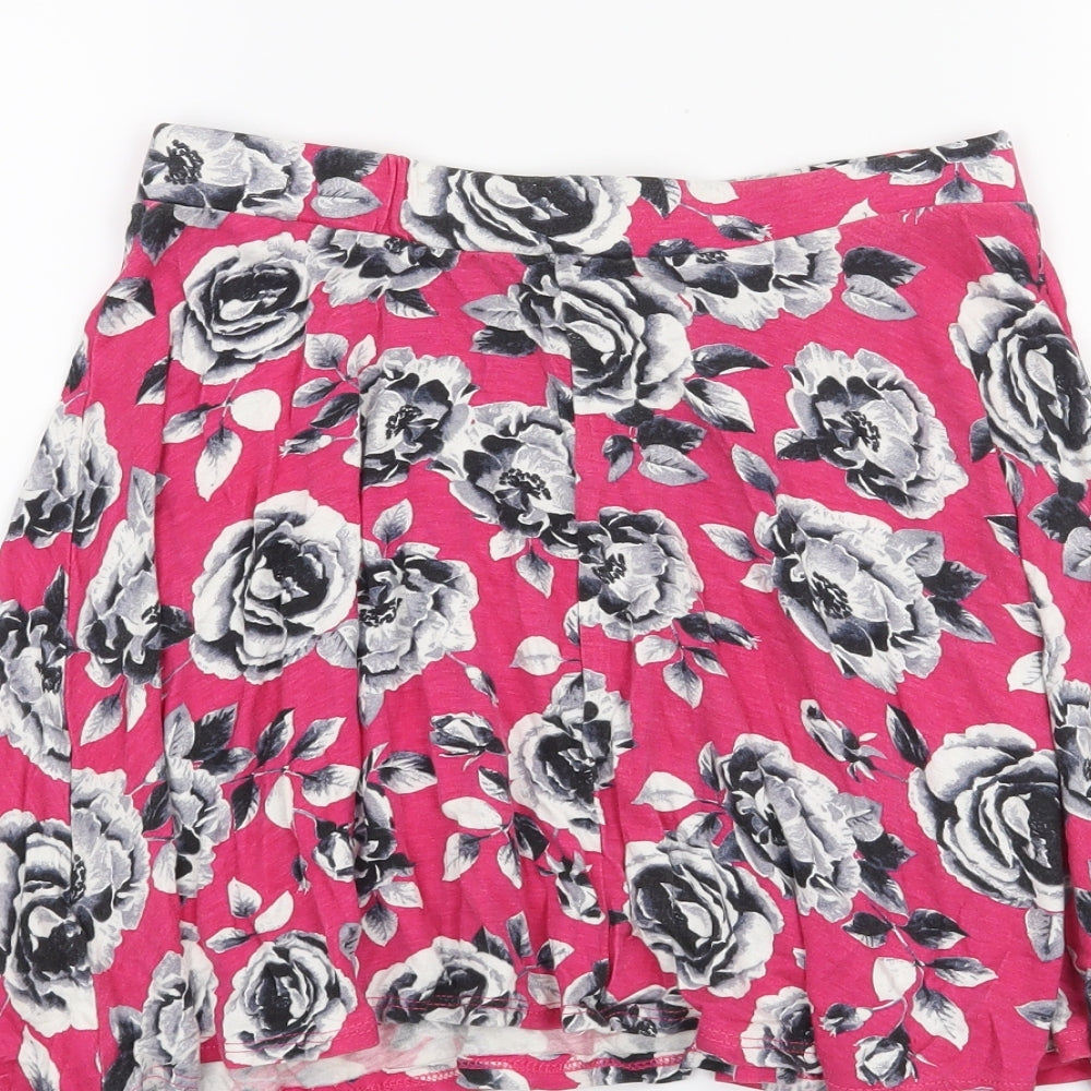 Brand and care label for YD girls’ orange floral skater skirt, size 10-11, years